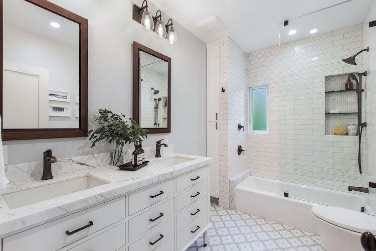 Elegant white bathroom remodel with dual vanity