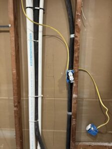 Proper bathroom exhaust fan ductwork venting through roof with R-6 insulation per Houston mechanical code