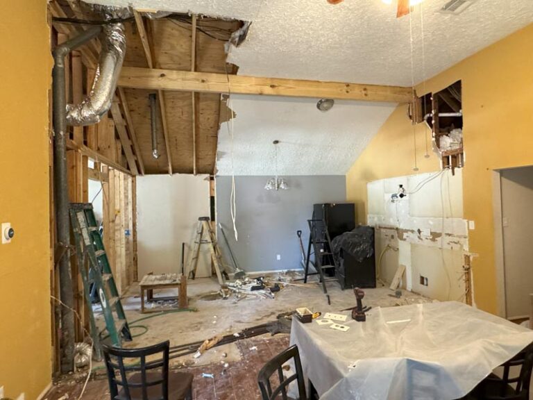 Kitchen wall opened up with exposed ceiling joists and ductwork during demolition - kitchen remodeling in Houston, TX