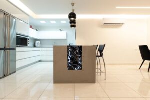 Kitchen island with bar seating and decorative panel details in Houston renovation