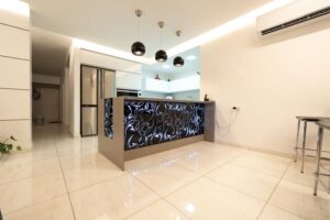 Front view of kitchen island with black scrollwork decorative panels in Houston renovation