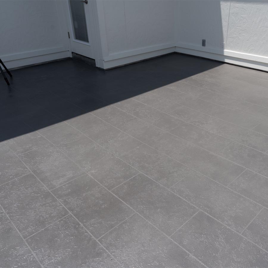 Professional photographer documenting completed balcony waterproofing Houston Heights