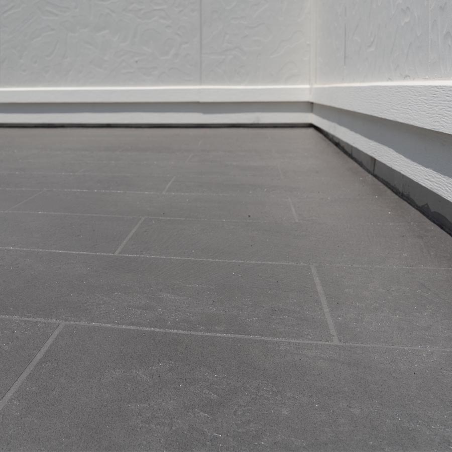 Waterproofed balcony with proper drainage and tile installation Houston 77007