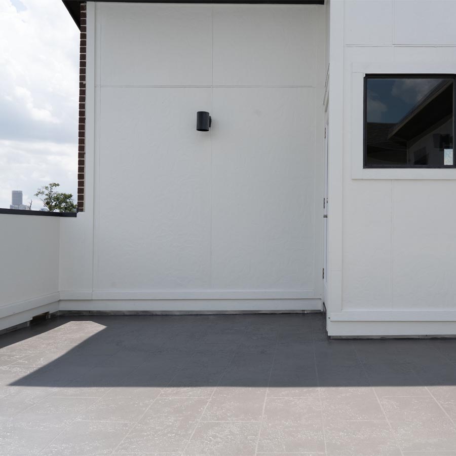 Completed balcony waterproofing with porcelain tile finish in Houston Heights 77007