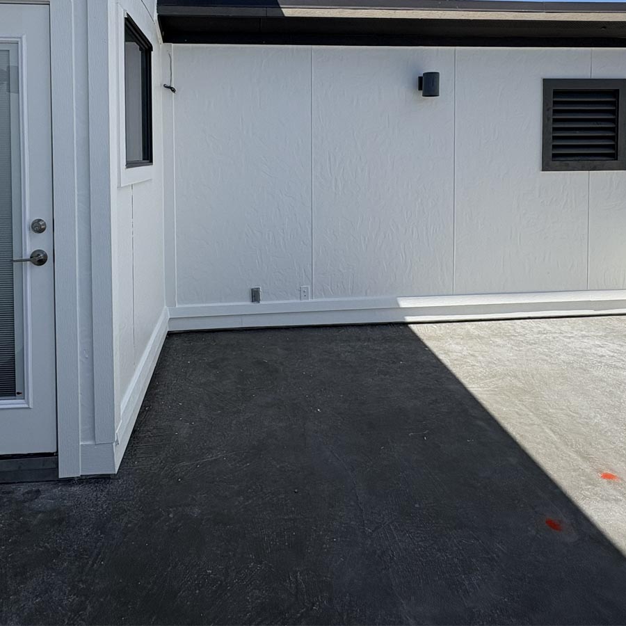 Balcony demolition revealing failed waterproofing system in 77007 townhome