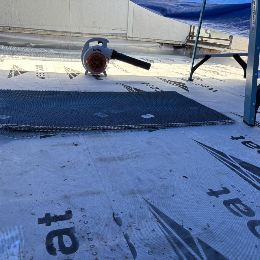 Balcony surface demolition exposing damaged substrate in Houston 77007