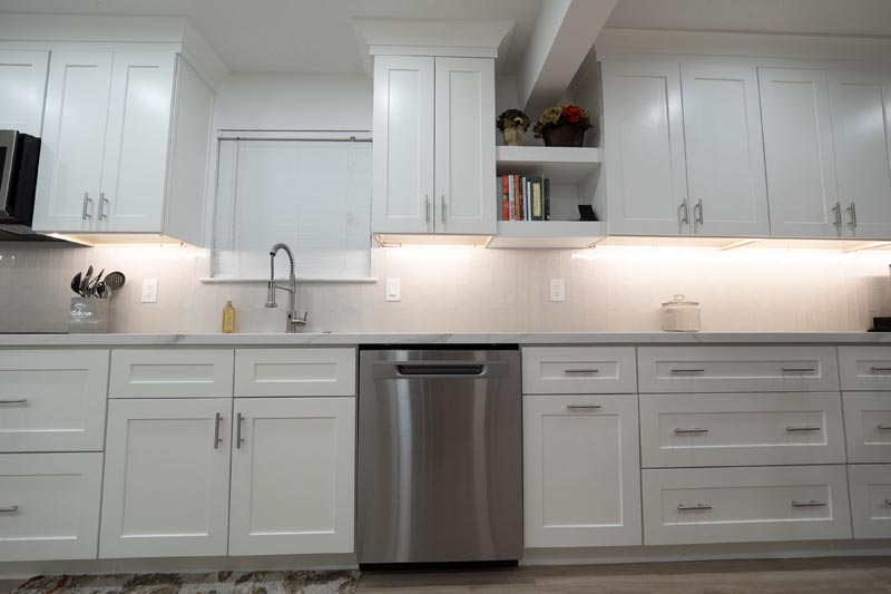 Long kitchen counter with multiple storage drawers and under-cabinet LED lighting Houston